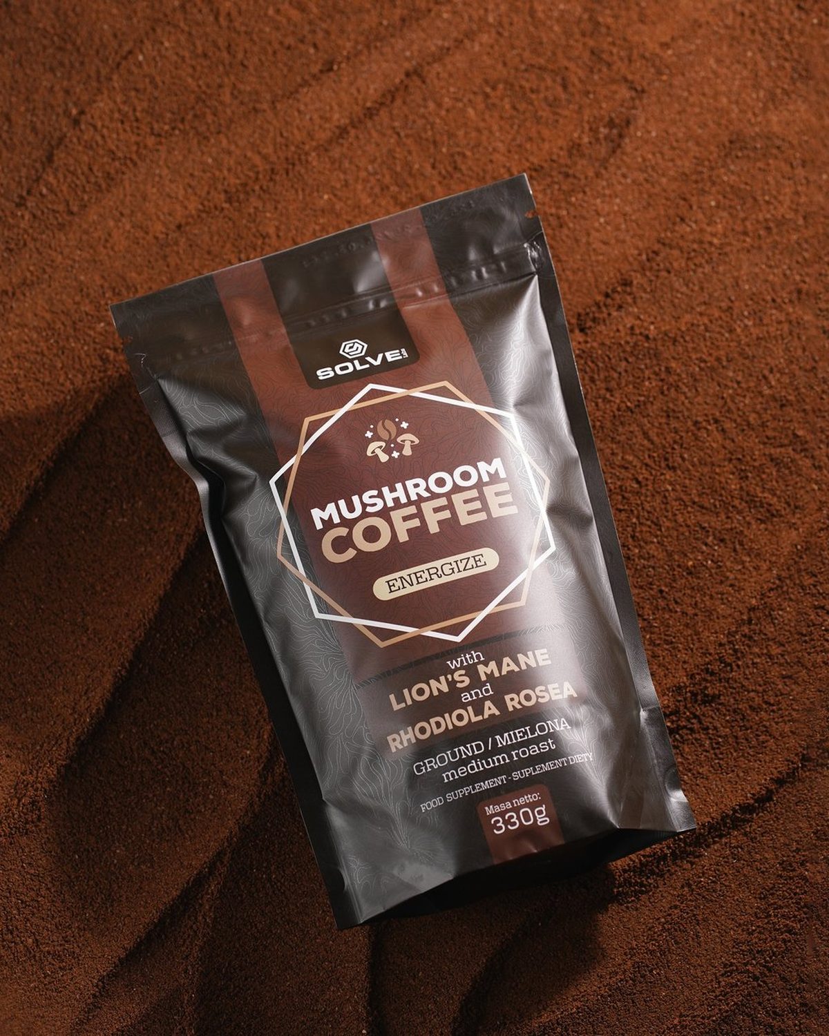 A bag of Mushroom Coffee with Lion’s Mane lying in ground coffee
