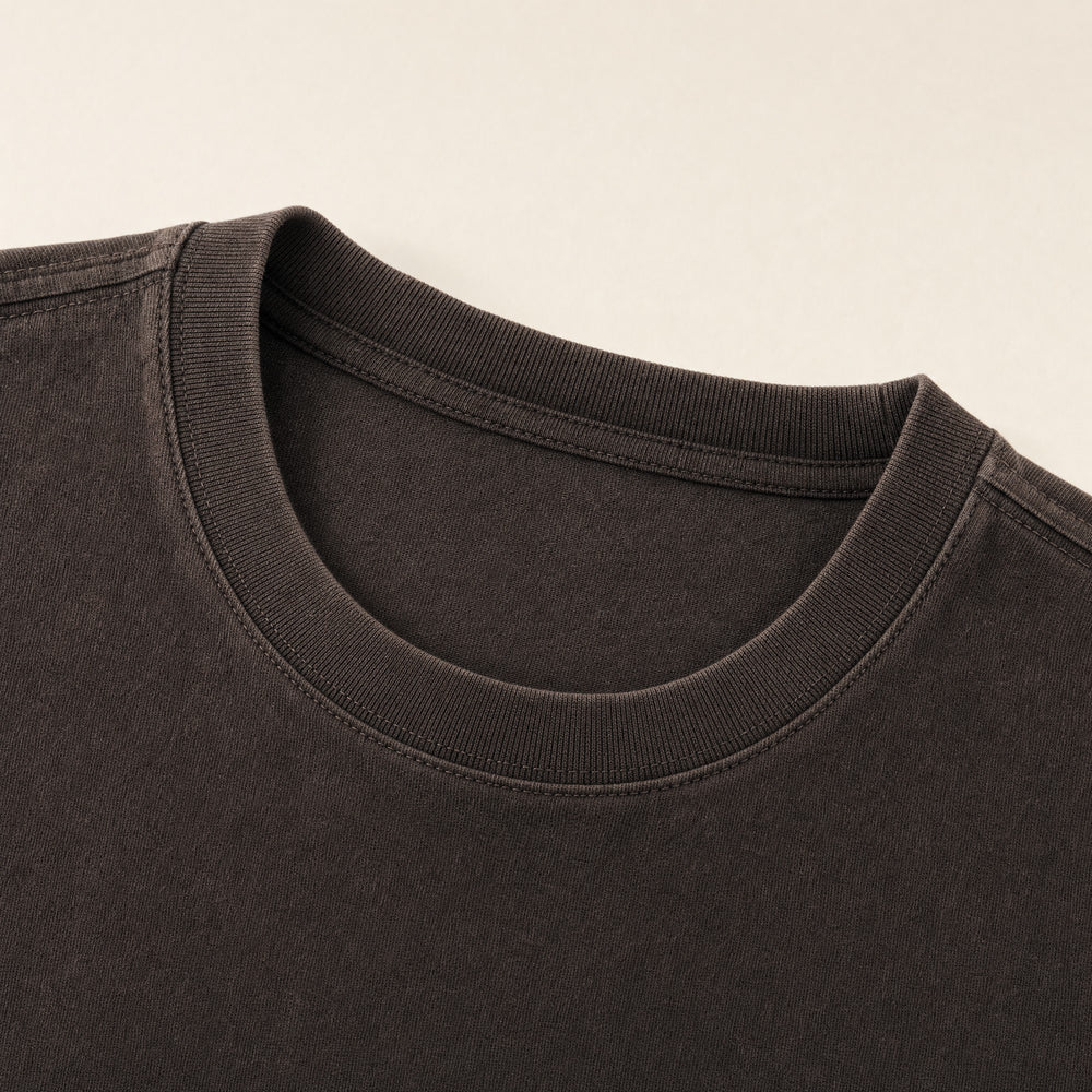 The ribbed collar of the Paths Tee