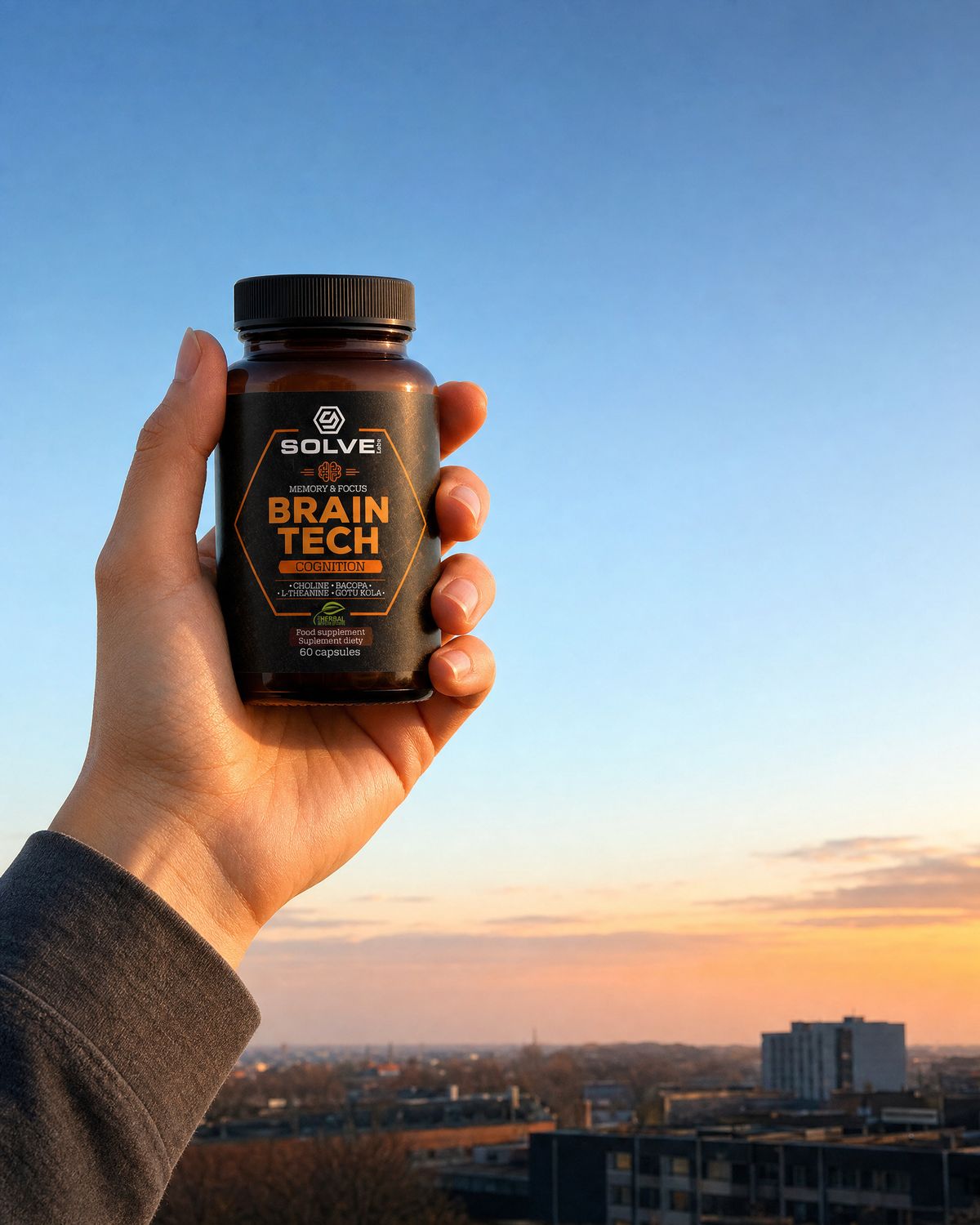 A hand holding up the jar of Solve Labs Brain Tech against an orange morning sky