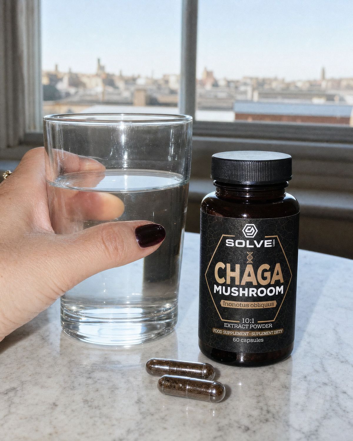 Two chaga capsules on a kitchen worktop beside a glass of water and the jar