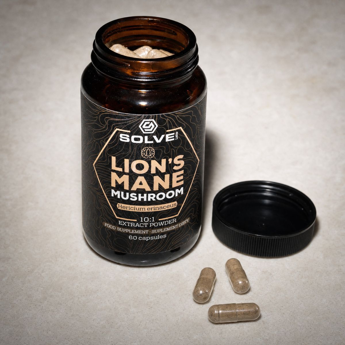 The open jar of Solve Labs Lion&rsquo;s Mane capsules, three capsules beside its cap