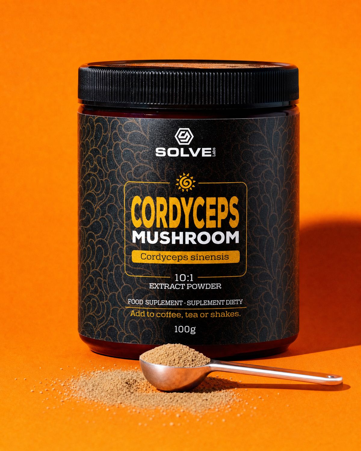 A jar of Solve Labs Cordyceps powder on an orange backdrop with a spoon of the powder