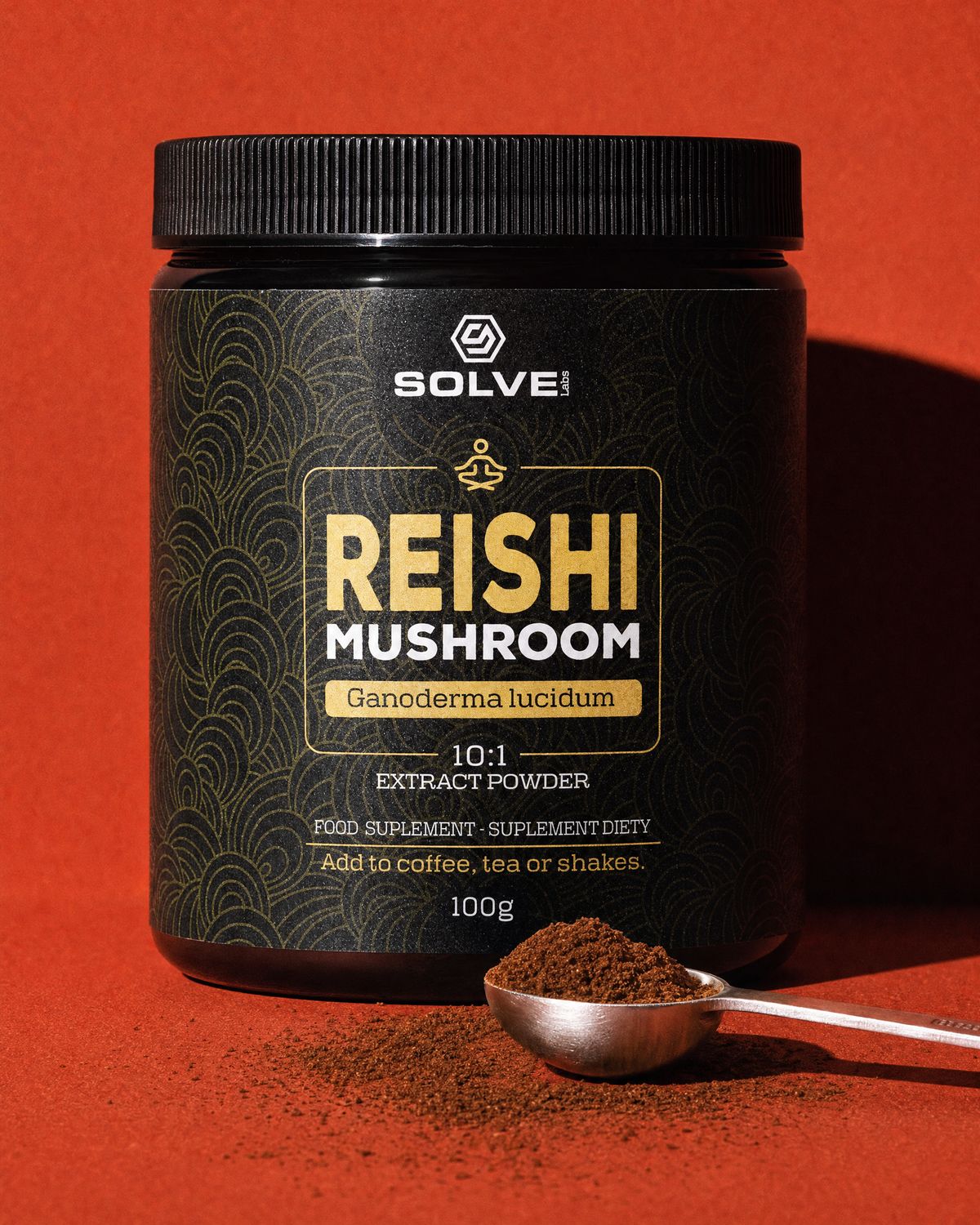 A jar of Solve Labs Reishi powder on a terracotta-red backdrop with a spoon of the powder