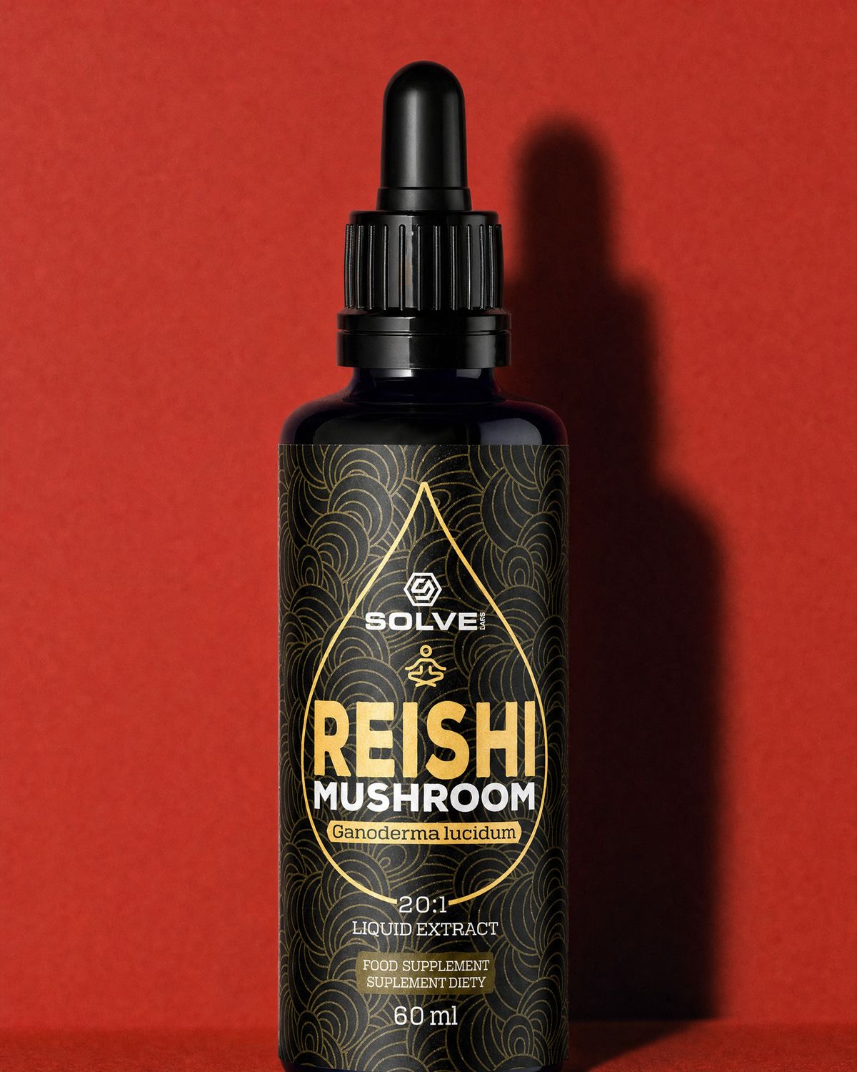 A bottle of Solve Labs Reishi drops on a terracotta-red backdrop