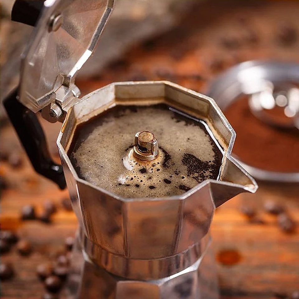 A moka pot of freshly brewed coffee seen from above