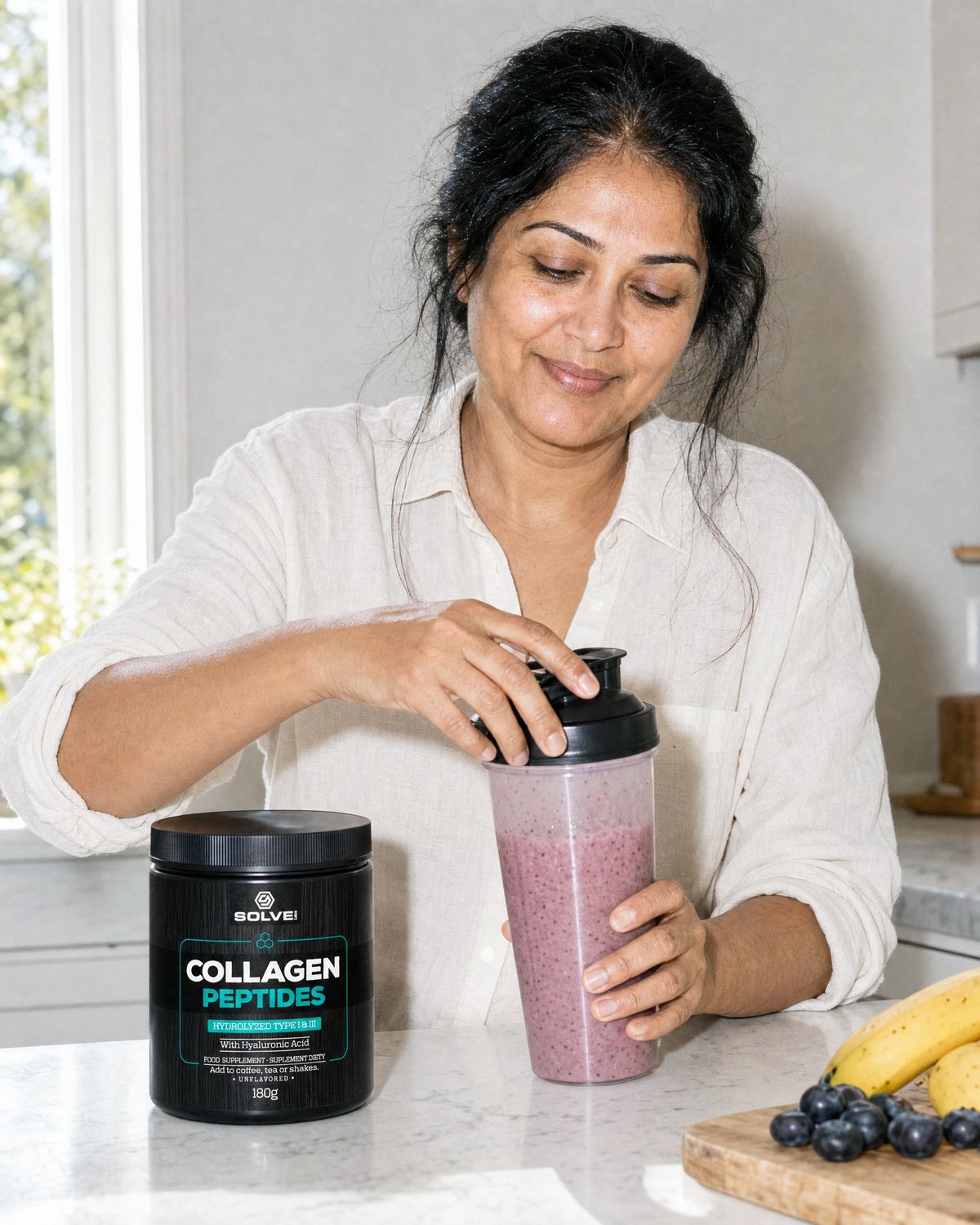 Hands closing a shaker of smoothie beside the tub