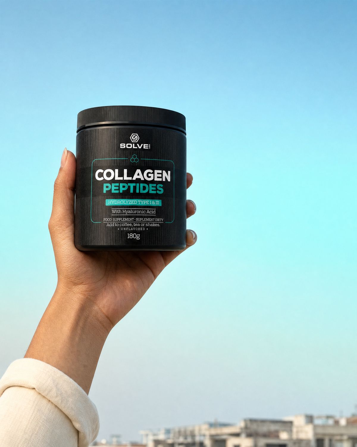 A hand holding up the tub of Solve Labs Collagen Peptides against a morning sky