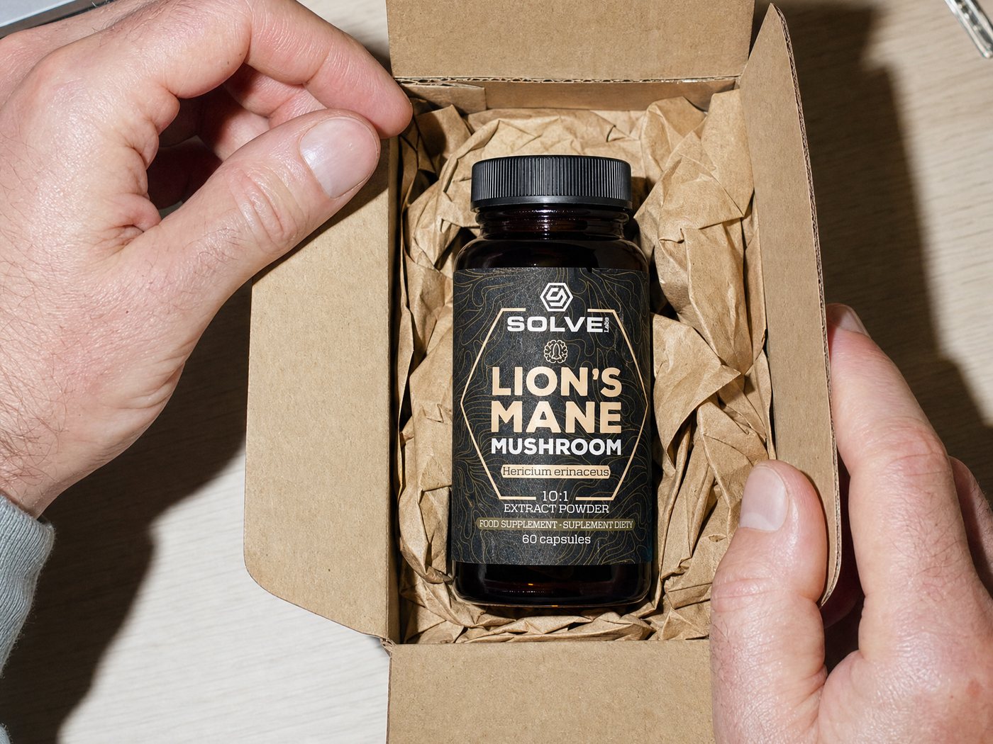Hands opening a delivery box with the Lion's Mane jar inside