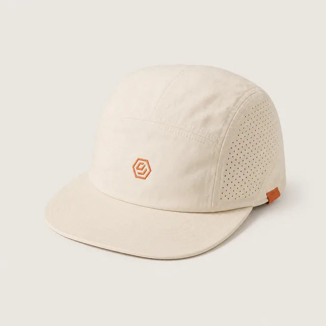 Solve Cap in bone with an orange hex mark