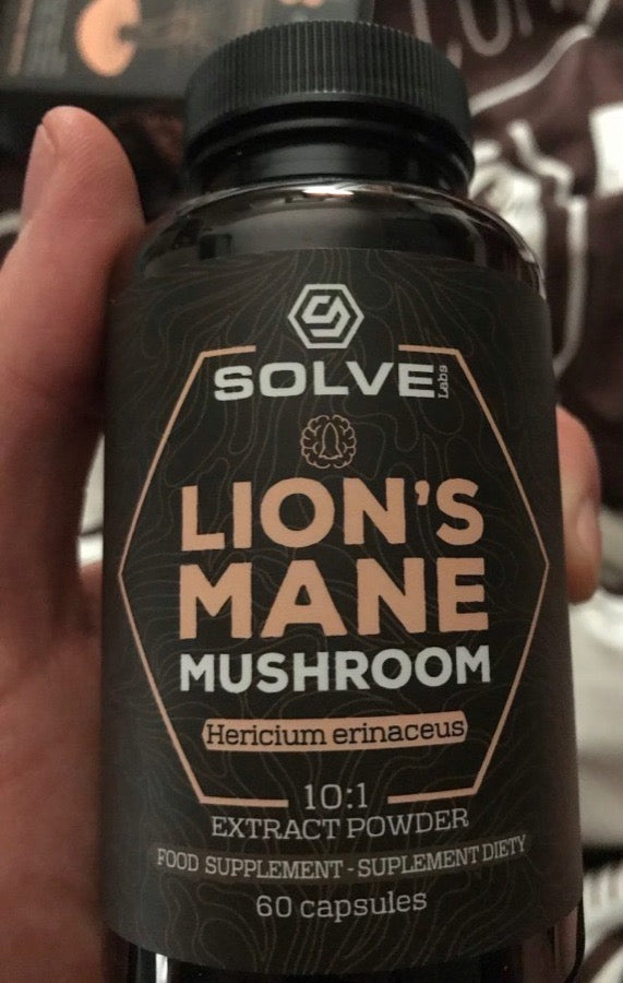 Buyer holding the Solve Labs Lion's Mane capsules jar
