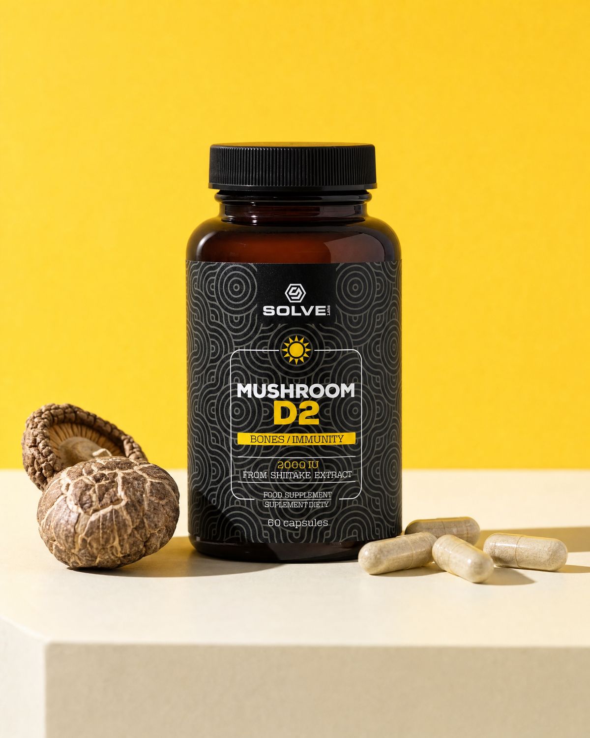 The jar of Solve Labs Mushroom D2 on a cream plinth against a yellow backdrop with dried shiitake and capsules